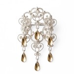 Barnesølje i hvit  og forgylt sølv