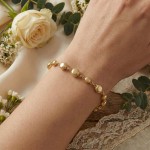 Armbånd med flate kuler i gult gull 14kt, 19 cm - 16998